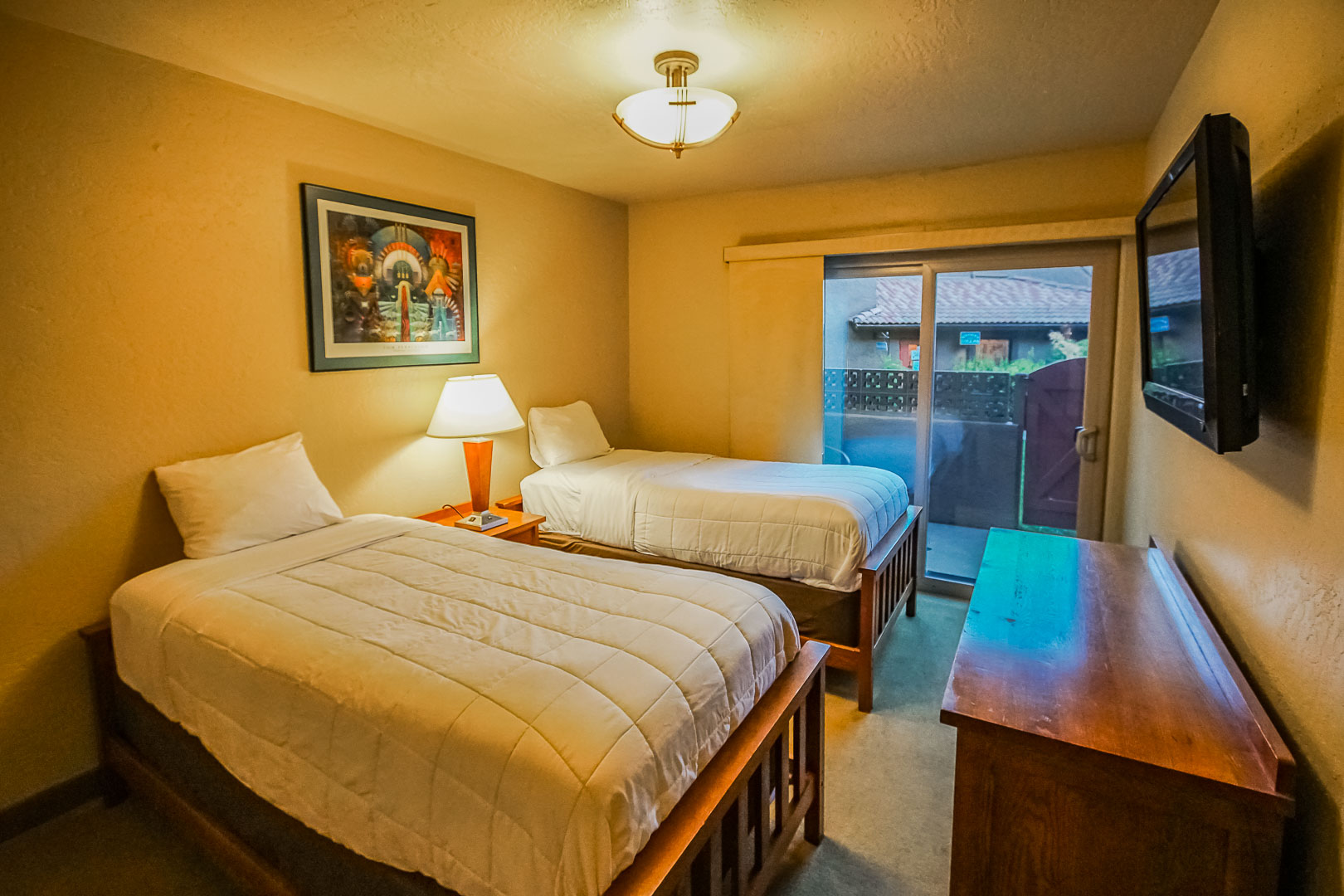 A bedroom with double beds at VRI's Villas of Sedona in Arizona.